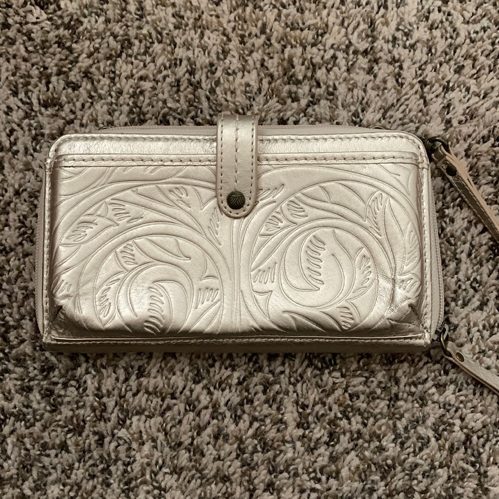 A taupe/light gold wristlet NWOT